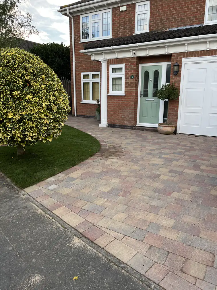 Brindle block paving driveway installation to a red-brick frontage, durable and smart with a neat soldier-course edge.
