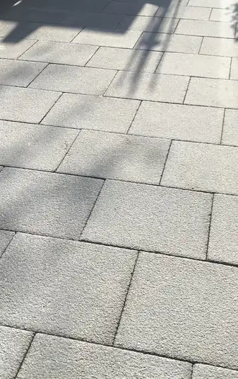 Textured granite-effect paving slab detail showing slip-resistant finish, safe underfoot in all seasons.